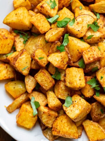Close up of air fryer diced potatoes.