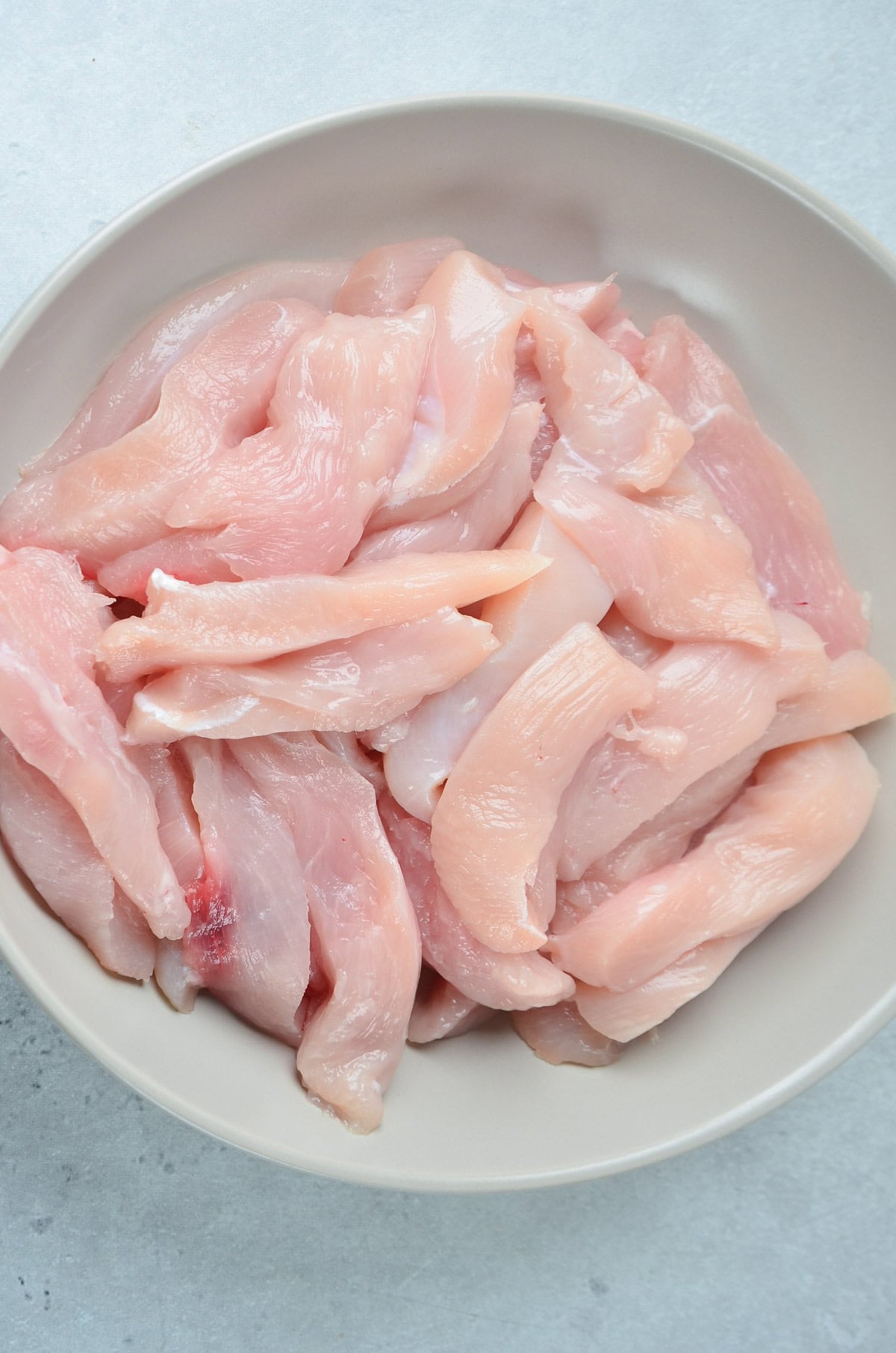 Sliced chicken into tenders.