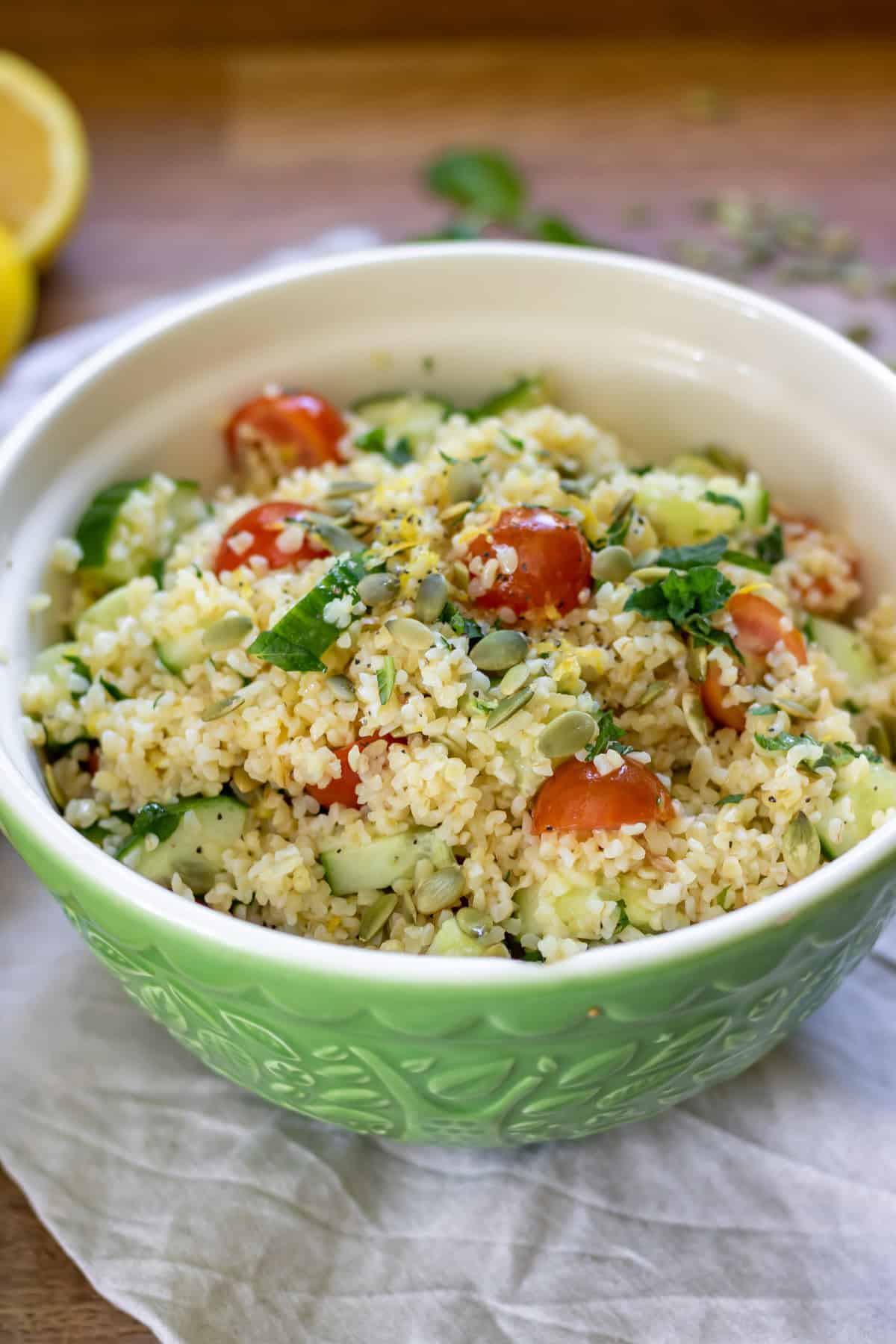 Bowl of bulgur salad with lemon dressing.