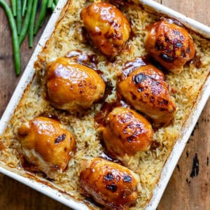 A baking dish of sticky honey soy chicken rice bake.