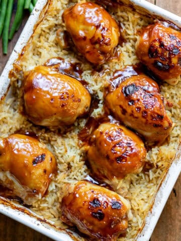 A baking dish of sticky honey soy chicken rice bake.