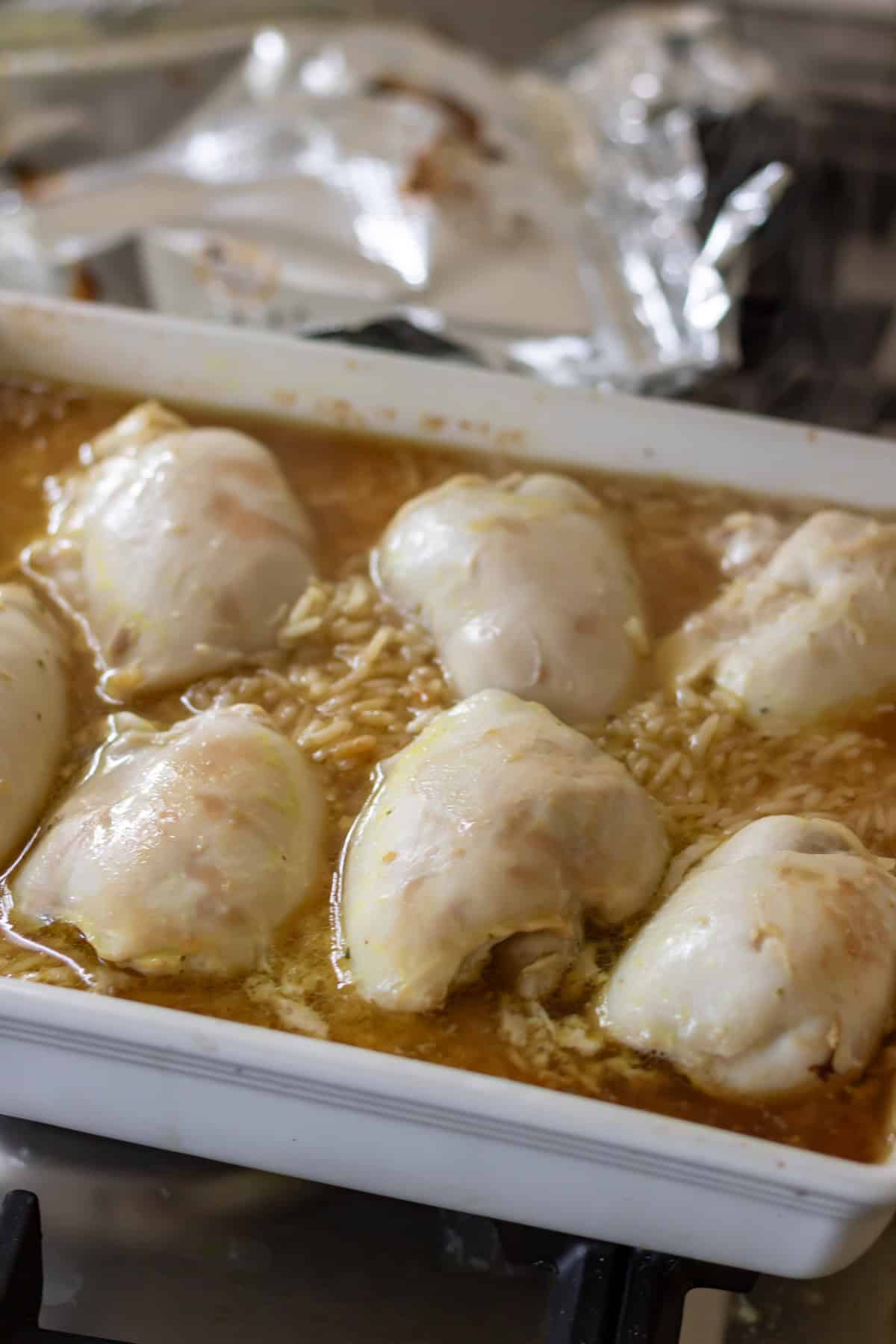 Partially cooked honey soy chicken rice bake.