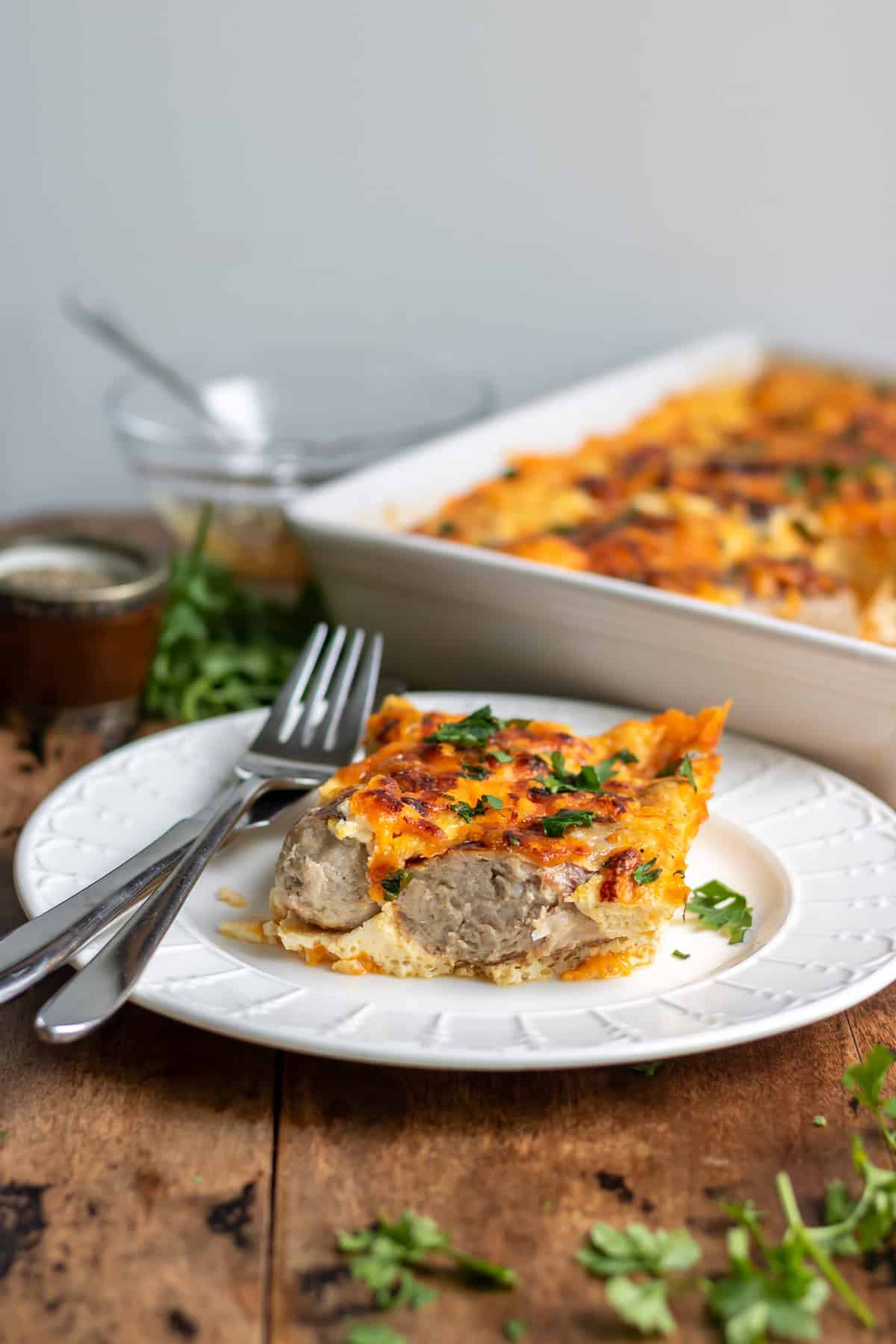 A plate with a slice of hot honey sausage breakfast bake.