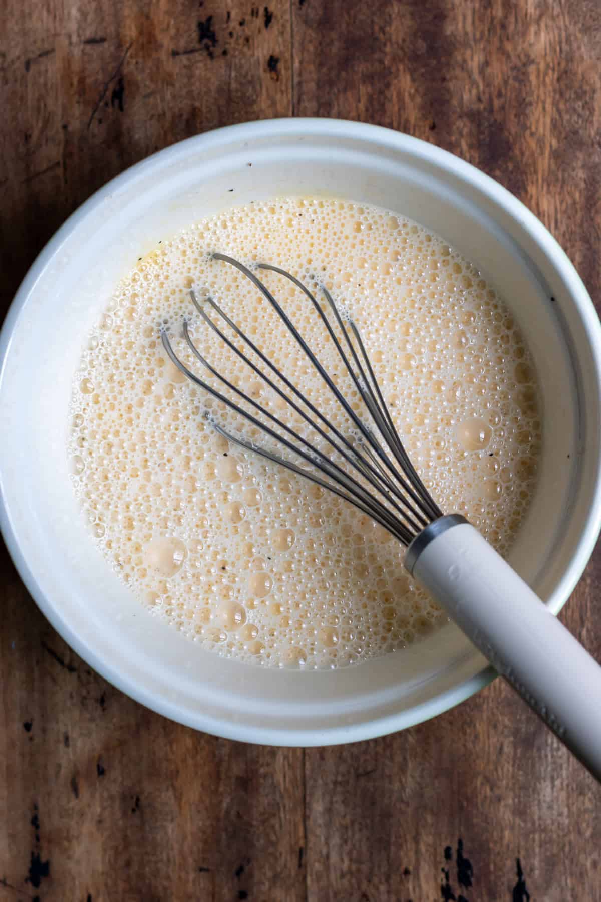 Whisking eggs in a bowl.