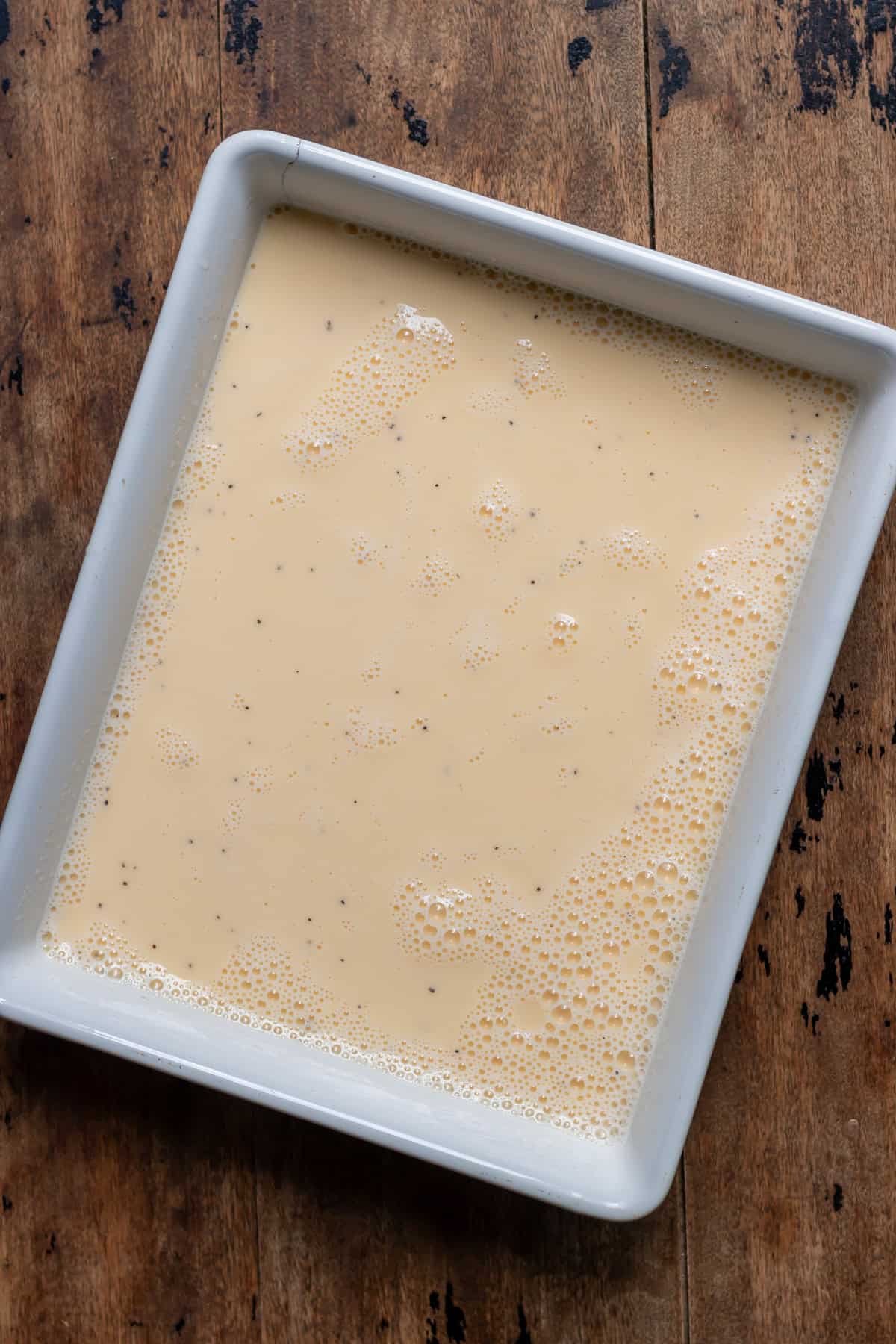 Whisked eggs poured into a baking dish.