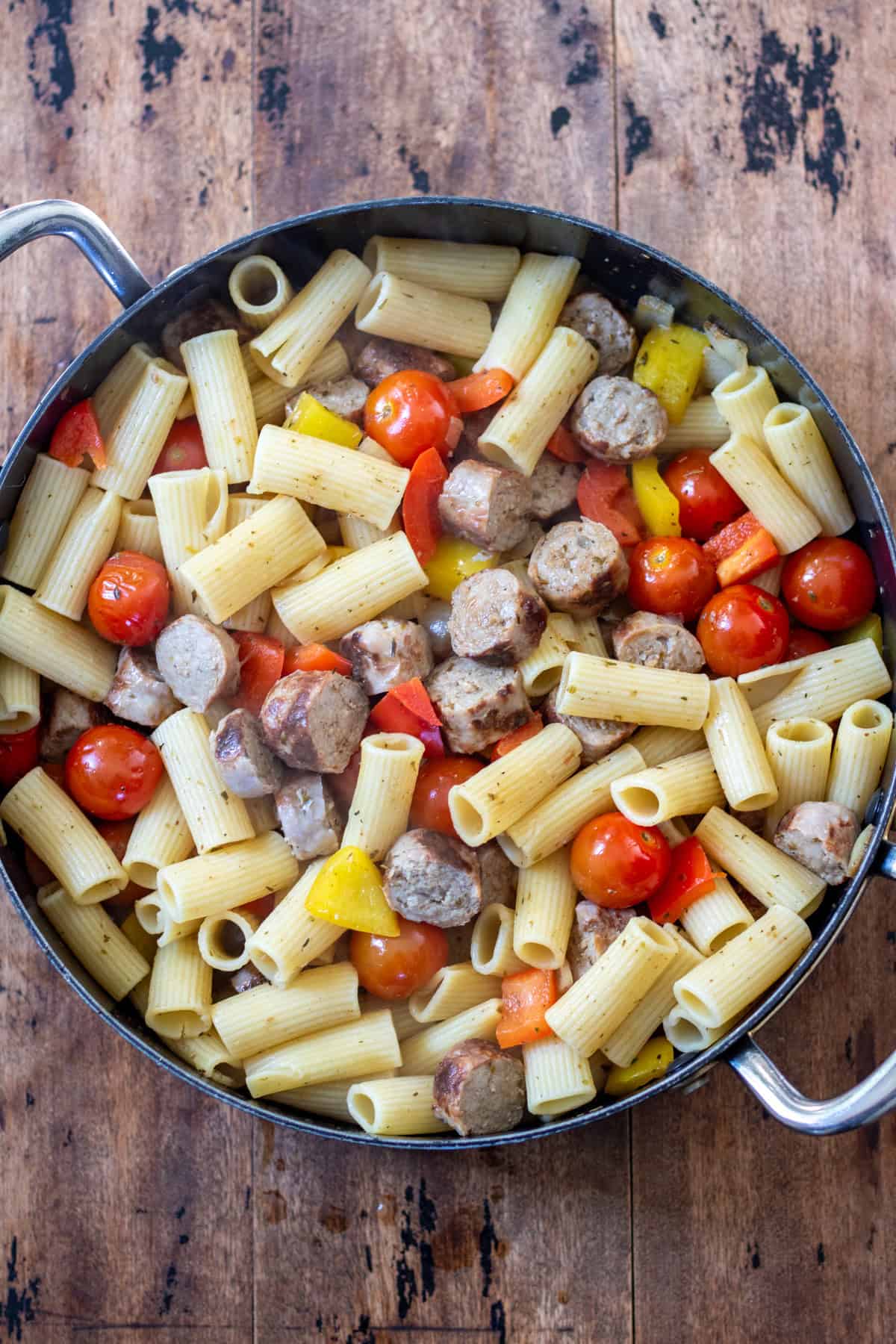 Cooked Italian sausage and peppers skillet.