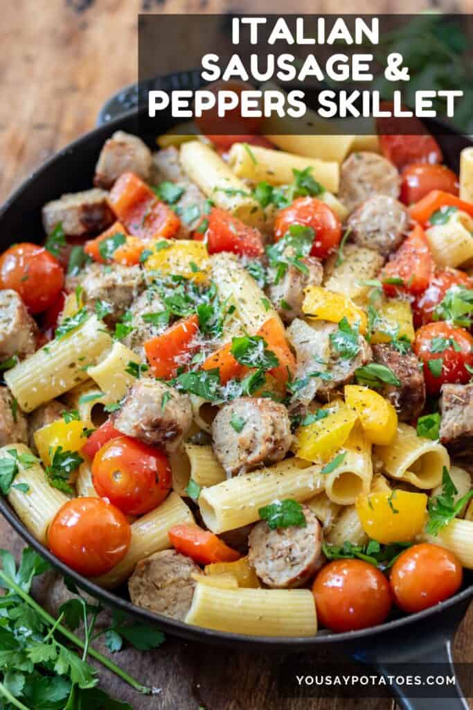 A skillet of Italian sausages, peppers and pasta with text: Italian Sausage and Peppers Skillet.