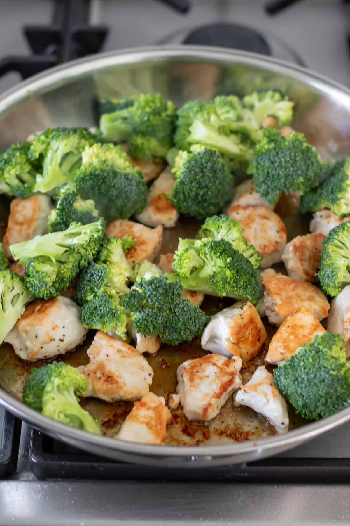 Broccoli added to the pan.