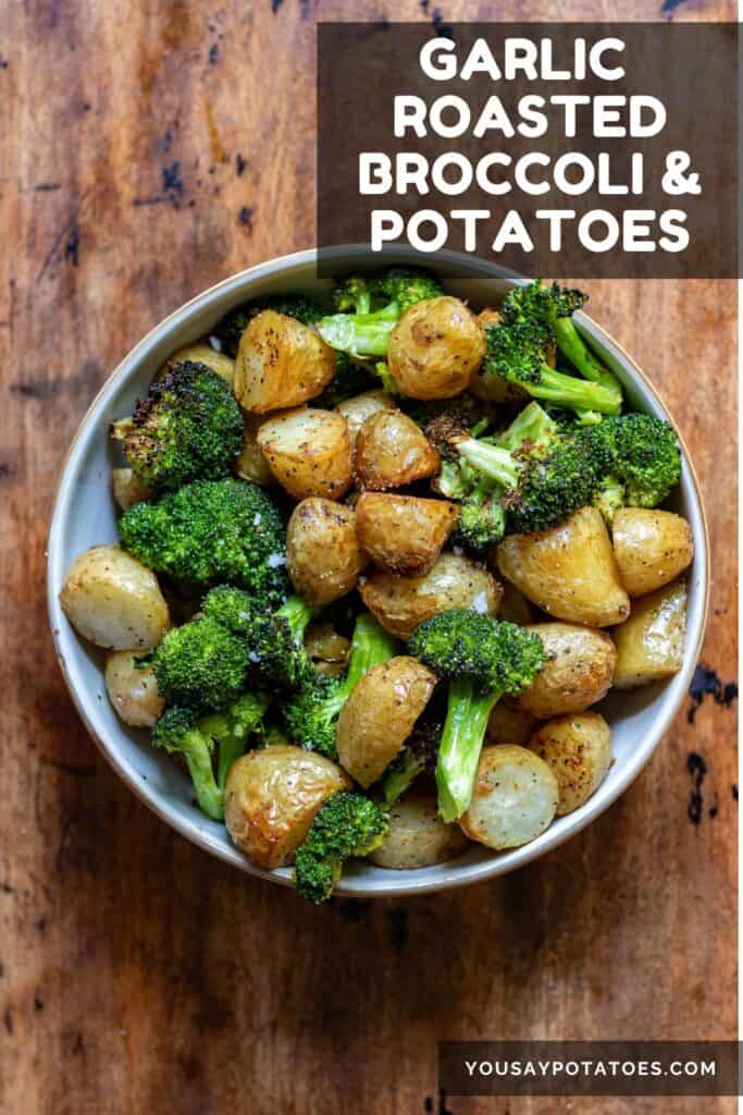Bowl of potatoes and broccoli, with text: Garlic Roasted Broccoli and Potatoes.
