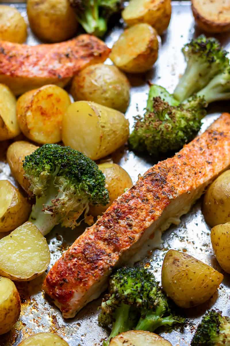 Close up of sheet pan salmon potatoes and broccoli.