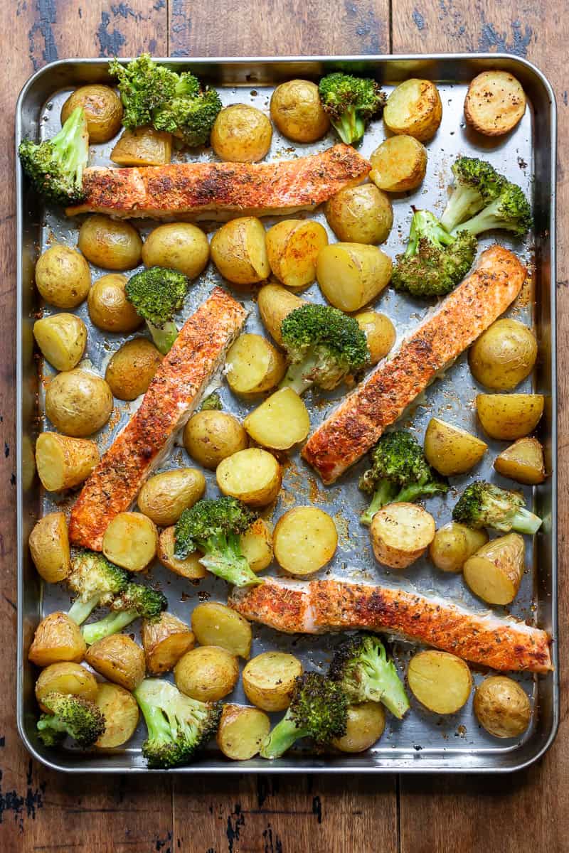 Cooked sheet pan salmon, potatoes and broccoli.