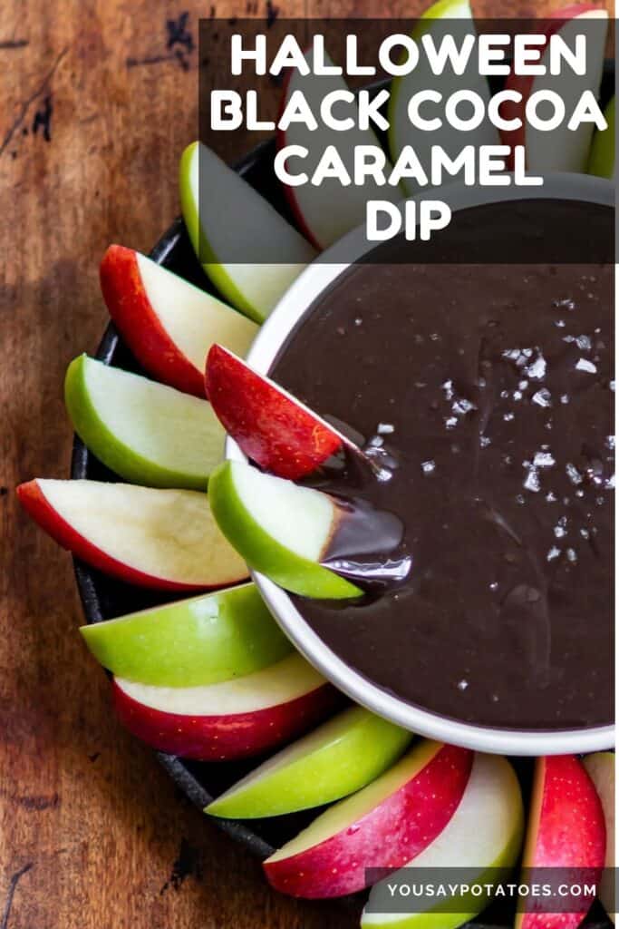 Bowl of black caramel surrounded by apple slices with text: Halloween Black Cocoa Caramel Dip.